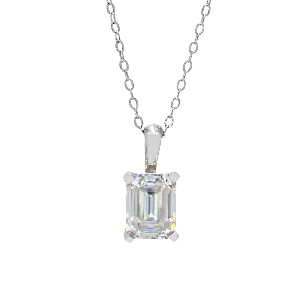 A product photo of a 8x6mm Rectangular Moissanite Pendant in 9ct White Gold suspended against a white background. The impressively large and dazzling stone is contrasted by its overall minimalistic design, 4 simple golden claws holding the gem in place. It is suspended by a simple gold chain. The stone is a bright white colour, reflecting rainbow hues across its multi-faceted edges.