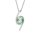 A product photo of a green amethyst pendant in solid 9 karat white gold suspended by a gold chain over a plain white background. The large, pale green amethyst stone is held in place by stylish, minimalistic sweeps of white gold, one on either side.