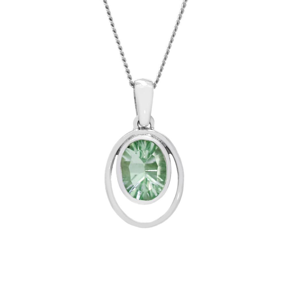 
            
                Load image into Gallery viewer, A product photo of a 5.5mm Round Bezel-set Green Amethyst Pendant in 9ct White Gold sitting on a plain white background. The bezel-set stone is nestled at the bottom of a golden oval hoop of similar thickness to the bezel frame. The peridot reflects chartreuse hues across its multi-faceted edges.
            
        