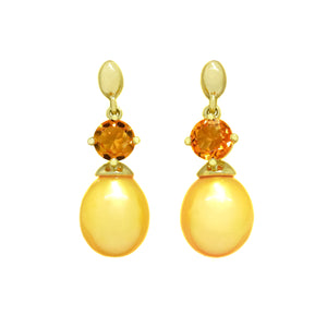 This product image features a pair of solid yellow gold gemstone and pearl earrings with a unique design. The main components are two fiery orange round-cut citrine jewels, each one set above a single, golden-coloured drop pearl, beautifully matching in colour.