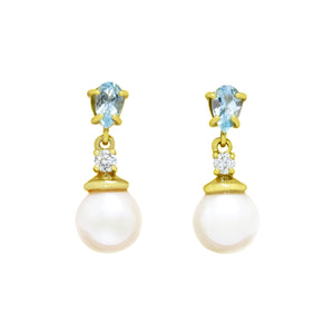 This product image features a pair of solid yellow gold pearl and aquamarine gemstone earrings. The pearls are white in colour, while the pear-shaped aquamarine has a beautiful blue hue that adds depth to the piece. On top of each pearl sits a small diamond, adding even more sparkle to the jewellery