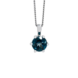 
            
                Load image into Gallery viewer, A product photo of a 6mm Round London Blue Topaz Pendant in 9k White Gold suspended by a gold chain against a white background. The stone is held in place by 6 delicate golden claws. The topaz reflects ocean blue hues across its multi-faceted edges.
            
        