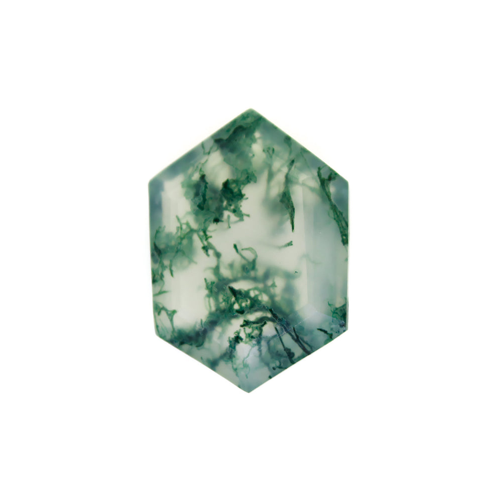 A product image of a loose 14x10mm faceted moss agate gemstone in the shape of an elongated hexagon. The stone has a cool white milky colour, with deep, swirling green natural inclusions - appearing as moss-like structures or delicate inkspills within the stone. The faceted edges reflect bright white light.