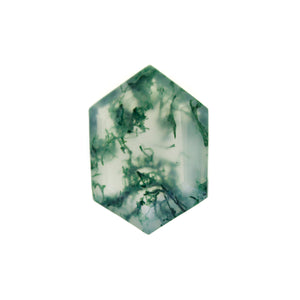 A product image of a loose 14x10mm faceted moss agate gemstone in the shape of an elongated hexagon. The stone has a cool white milky colour, with deep, swirling green natural inclusions - appearing as moss-like structures or delicate inkspills within the stone. The faceted edges reflect bright white light.