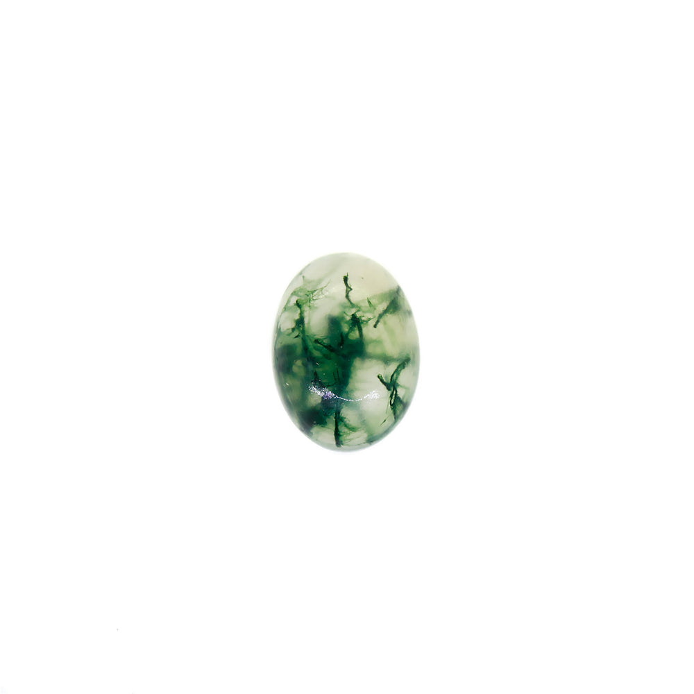 A product image of a loose 7x5mm cabochon oval-cut moss agate stone. The stone has a cool white milky colour, with deep, swirling green natural inclusions - appearing as moss-like structures or delicate inkspills within the stone. The faceted edges reflect bright white light.