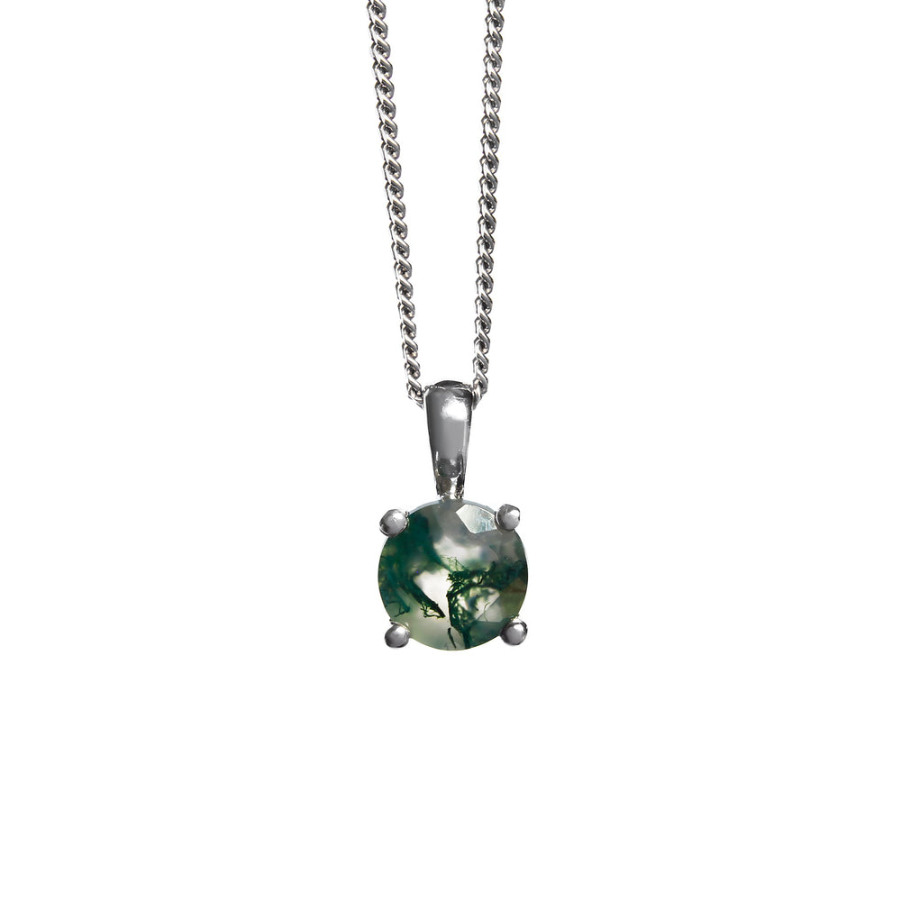 A product photo of a 6mm round moss agate pendant in 9k white gold suspended against a white background. The stone is held in place by 4 delicate golden claws, with light semi-opaque base colouring and swirling, inky tendrils of deep green inclusions.