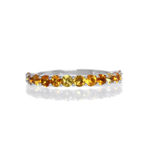 
            
                Load image into Gallery viewer, A product photo of a silver eternity band with 13 citrine stones embedded along its length on a white background.
            
        