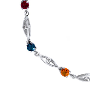 A product photo made up of a silver multi-gemstone bracelet featuring 4mm trilliant Blue Topaz, Garnet, Citrine, London Blue Topaz, Amethyst, Tanzanite, Peridot and Rhodalite, all interspersed with hollow silver marquise shapes punctuated with singular bezel-set diamonds.
