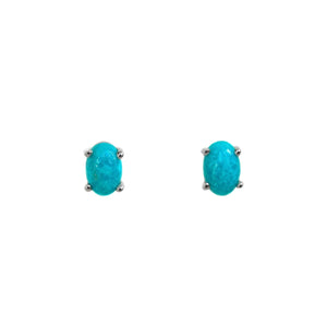 A product photo of 5x4mm oval-shaped turquoise stud earrings in silver sitting on a plain white background. The 2 turquoise stones measure 4mm across and are a bright blue colour, held in place by 4 silver claws.