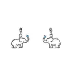 A product photo of a pair of silver earrings, both in the shape of an African elephant with an aquamarine stone at the end of each trunk. The earrings are suspended against a white background.
