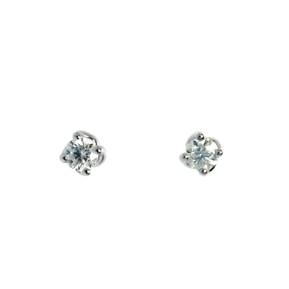 A product photo of 3mm Round moissanite stud earrings in 9k white gold sitting on a plain white background. The stones are held in place by 4 delicate silver claws arranged in a flower-like pattern where they meet the stud.