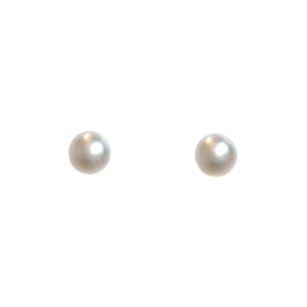 A product photo of a simple pair of white pearl earring studs set in solid 9 karat white gold on a white background.