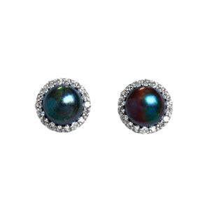 A product photo of a pair of 9 karat white gold diamond halo pearl earrings on a white background. The pearls have unique splashes of colour and patterns, and are both a deep peacock colour base.