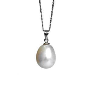 A product photo of a pearl pendant hanging by a white gold chain over a white background. The featured stone is a 13.4x11.2mm White Pearl with a soft cream sheen.
