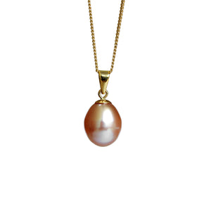 A product photo of a pearl pendant hanging by a yellow gold chain over a white background. The featured stone is a 11x9mm Peach Pearl with a soft orange sheen.