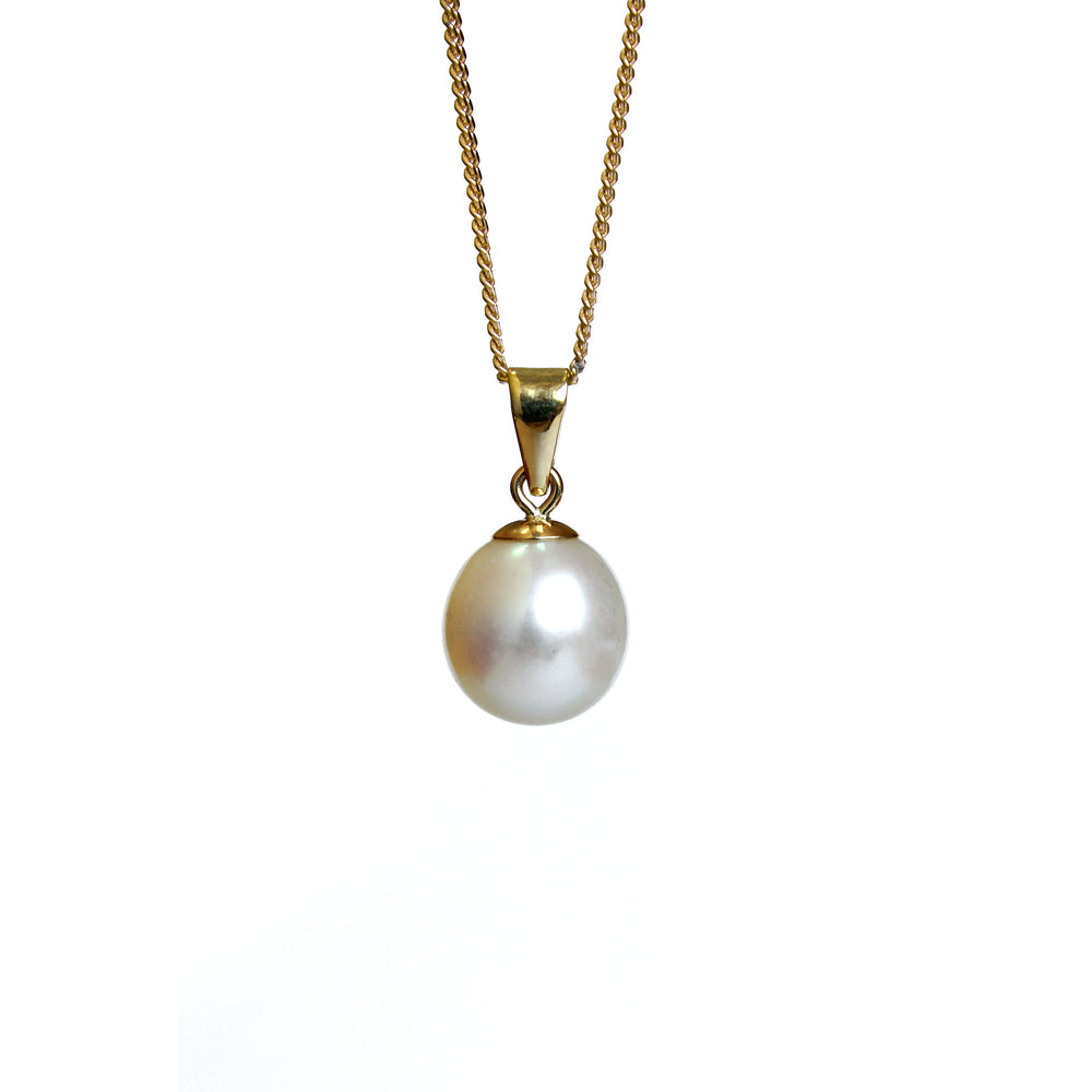 A product photo of a pearl pendant hanging by a yellow gold chain over a white background. The featured stone is a 9.5x8mm White Pearl with a soft cream sheen.